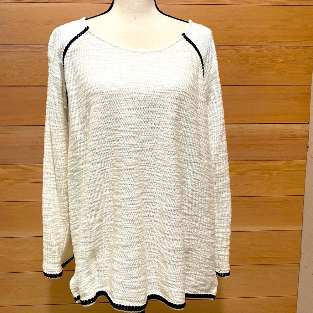 Cream sweater with black trim